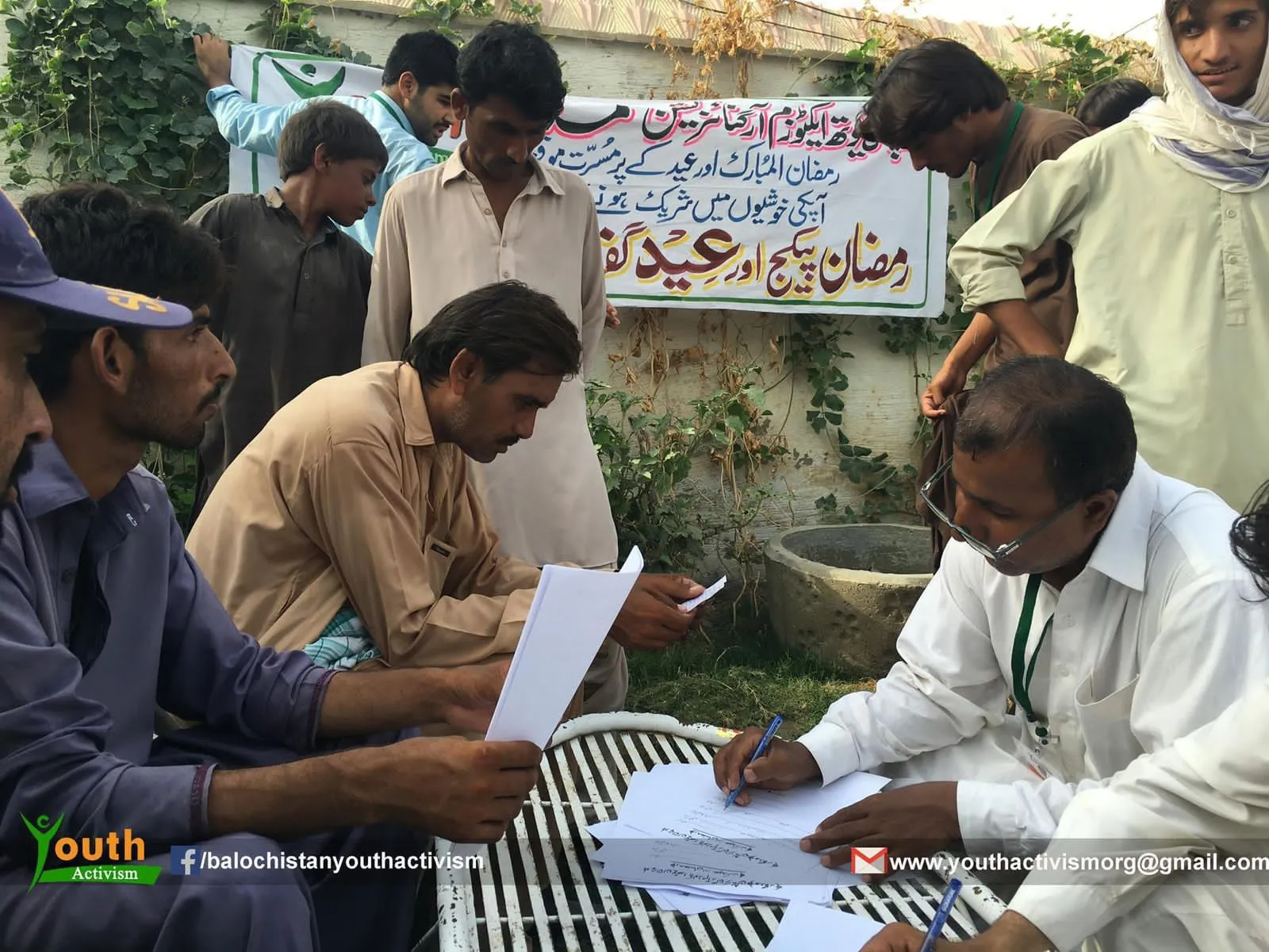 Volunteers registering families at a relief distribution point