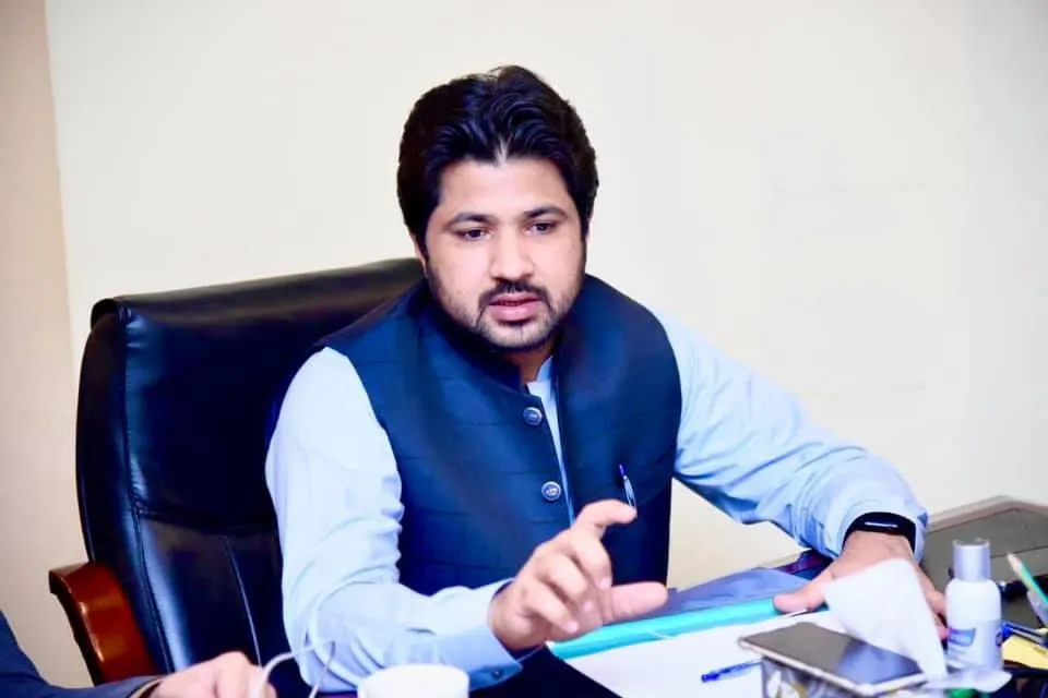 Arif Rind working at his office desk